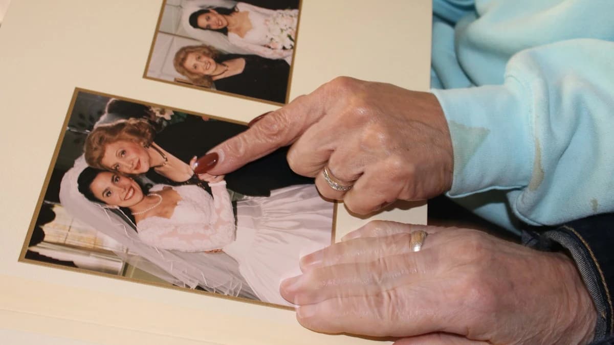 FlowAIVideo use case: older hands holding cherished family photos